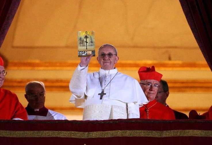 Pope Francis readies his free promotional copy of O&H to toss to one lucky supporter in St. Peter's Square